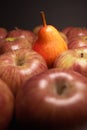 Closeup of pear and apples (one different) Royalty Free Stock Photo