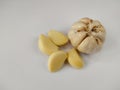 Closeup peeled garlic Allium sativum on a white background