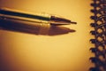 Closeup pen on a brown notebook paper Royalty Free Stock Photo
