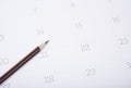 Closeup pencil on calendar. organization management remind