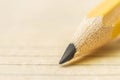 closeup of pencil lead touching the center of a paper sheet Royalty Free Stock Photo
