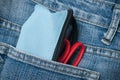Pencilcase and scissors on blue jeans pocket Royalty Free Stock Photo