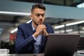 Closeup of pensive middle eastern businessman looking at notebook screen Royalty Free Stock Photo