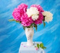 Closeup of peony flowers, fluffy pink peonies flowers, peony bunch in vase on the table Royalty Free Stock Photo