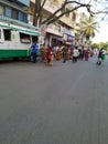 Closeup of People Crowd or Queue in front of the Mobile Indira Canteen to collect food by poor people