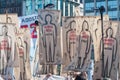 Closeup of people with the images of people kidnapped and disappeared during a military dictatorship