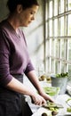 Closeup of people preparing vegetable to be cooked in the kitchen