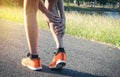 Woman walking on the road get accident for her legs the image is for health concept. Royalty Free Stock Photo