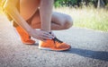 Woman walking on the road get accident on her ankle the image is for health concept. Royalty Free Stock Photo