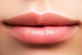 Closeup perfect natural lip makeup. Beautiful plump full lips on female face. Clean skin, fresh make-up. Spa tender lips Royalty Free Stock Photo