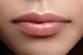 Closeup perfect natural lip makeup. Beautiful plump full lips on female face. Clean skin, fresh make-up. Spa tender lips
