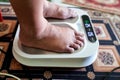 Closeup of person feet receiving magnetic therapy from electricity powered geomagnetic device, promising general well