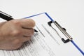 Closeup of a person signing a Form letter of intent for land acquisition