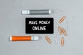 Closeup of a personal agenda with words - Make Money Online - written on a business card with a felt-tip pen Royalty Free Stock Photo