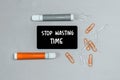 Closeup of a personal agenda with words - Stop Wasting Time - written on a business card with a felt-tip pen Royalty Free Stock Photo