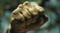 A closeup of a persons clenched fist representing the power of the mind and its ability to push through physical