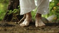 A closeup of a persons feet rooted firmly on the ground in a Tai Chi stance symbolizing the connection to the earth and Royalty Free Stock Photo