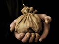 A closeup of a persons hand tightly gripping a pocketful of coins their only means of survival for the week.. AI