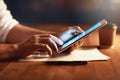 Closeup of a persons hands holding and scrolling on a digital tablet planning late in the evening at night. Modern man