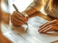 Closeup of a persons hands signing a document with a pen. Warm lighting creates a professional yet approachable atmosphere,