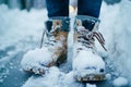 closeup of a persons snowcovered boots