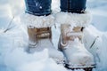 closeup of a persons snowcovered boots