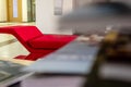 A closeup perspective shoot of a red sofa - focus on edge of sofa