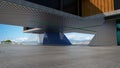 Closeup and perspective view of empty cement floor with steel and glass modern building exterior