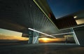 Closeup and perspective view of empty cement floor with steel and glass modern building exterior