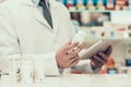 Closeup Pharmacist Holding Pills Bottle and Tablet