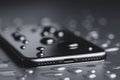 Closeup phone be waterproof shot on black background Royalty Free Stock Photo