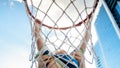Closeup photo of active 3 years old toddler boy holding on basketball net ring. Concept of active and sporty children Royalty Free Stock Photo