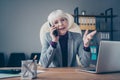 Closeup photo of aged business lady conversation telephone investors excited chief sit chair wear specs costume jacket Royalty Free Stock Photo