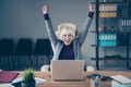 Closeup photo of aged business lady hands raised up investment success notebook table sit office chair wear specs Royalty Free Stock Photo