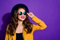 Closeup photo of amazing lady looking far away wear stylish hat yellow costume isolated purple background Royalty Free Stock Photo