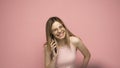 Closeup photo of attractive positive laughing young blonde woman wearing stylish yellow shirt and glasses communicating Royalty Free Stock Photo