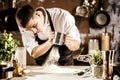 Closeup photo of baker cracking egg for dough. Retro styled imagery