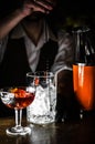 Closeup photo in a bar where barmen makes cocktail