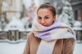 Young woman face covered with light colored knitted scarf Royalty Free Stock Photo