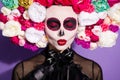 Closeup photo of beautiful dead witch religion folklore creature death day face print makeup masquerade send kiss eyes Royalty Free Stock Photo