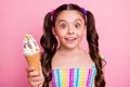 Closeup photo of beautiful funny little lady two long tails hold big cone gelato cream spot on nose carefree good mood