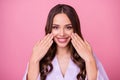 Closeup photo of beautiful lady long curly hairstyle spa salon procedure feel well look mirror touch arms cheekbones Royalty Free Stock Photo