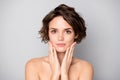 Closeup photo of beautiful nude lady short bob hairdo rejuvenation spa salon procedure soft facial skin touch arms Royalty Free Stock Photo