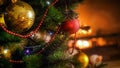 Closeup photo of beautiful red and golden bauble with colorful light garlands on Christmas tree at night Royalty Free Stock Photo