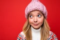 Closeup photo of beautiful thoughtful dreaming positive young blonde woman standing isolated over colourful background