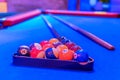 Blue billiard table, balls and cue Royalty Free Stock Photo