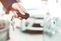 Closeup of hands of a businesswoman Using a remote control car key Royalty Free Stock Photo