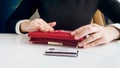 Closeup photo of businesswoman holding leather wallet and credit cards Royalty Free Stock Photo
