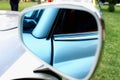 Closeup photo of a car mirror body part Royalty Free Stock Photo