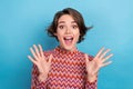 Closeup photo charming excited lady hands up in air open mouth overjoyed news wear print top isolated blue color